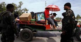 Philippines imposes martial law in massacre province 